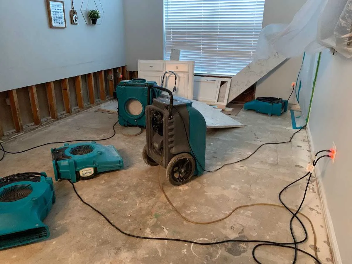 Dehumidifier in flood-cut room for Water Damage Restoration in Artesia